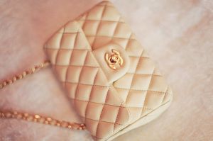 gold and cream chanel quilted handbag.jpg